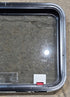 Used Black Radius Emergency Opening Window : 29 1/4" W x 21 1/2" H x 1 3/4" - Young Farts RV Parts