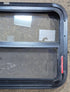 Used Black Radius Emergency Opening Window : 29 1/4" W x 21 1/4" H x 1 1/2" - Young Farts RV Parts