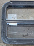Used Black Radius Emergency Opening Window : 29 1/4" W x 21 1/4" H x 1 1/2" - Young Farts RV Parts