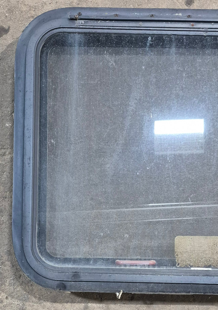 Used Black Radius Emergency Opening Window : 29 1/4" W x 21 1/4" H x 1 7/8" D - Young Farts RV Parts
