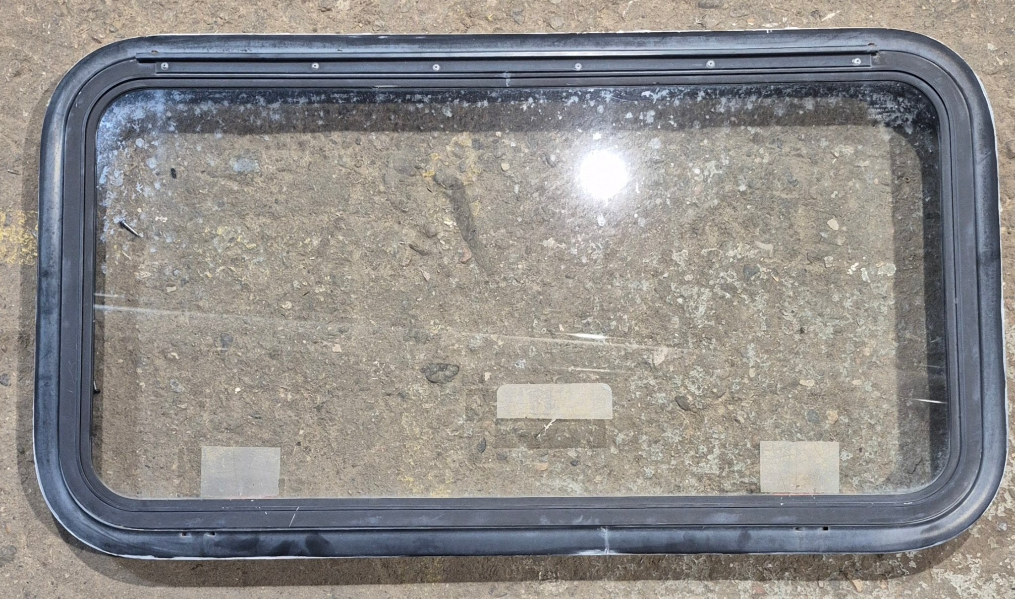 Used Black Radius Emergency Opening Window : 35 1/2" W x 18 1/2" H x 1 7/8" - Young Farts RV Parts