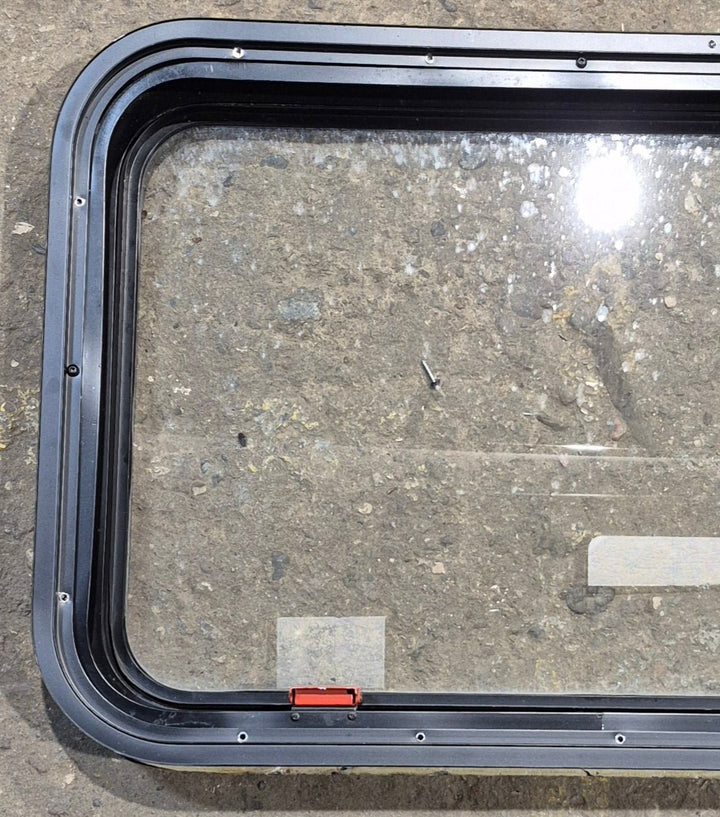 Used Black Radius Emergency Opening Window : 35 1/2" W x 18 1/2" H x 1 7/8" - Young Farts RV Parts
