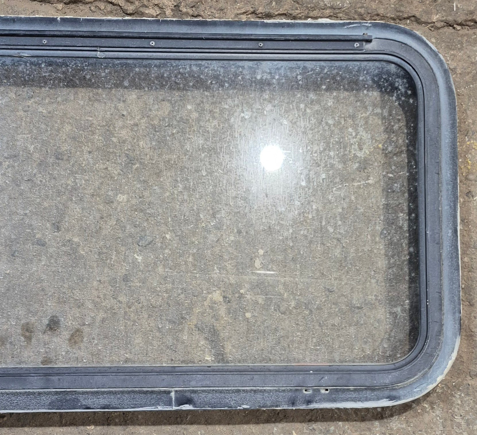 Used Black Radius Emergency Opening Window : 35 1/2" W x 18 1/2" H x 1 7/8" - Young Farts RV Parts