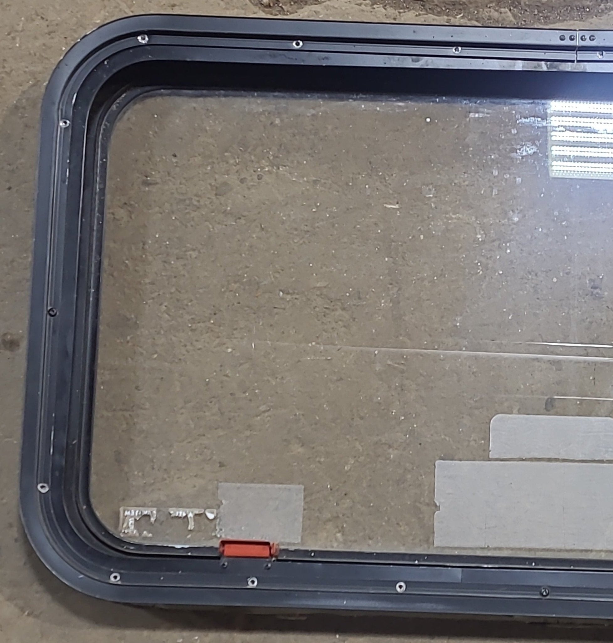 Used Black Radius Emergency Opening Window : 35 1/2" W x 18 1/2" H x 1 7/8" D - Young Farts RV Parts