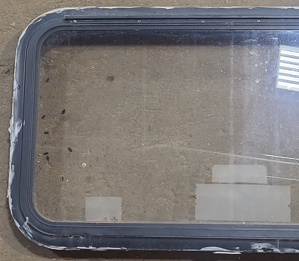 Used Black Radius Emergency Opening Window : 35 1/2" W x 18 1/2" H x 1 7/8" D - Young Farts RV Parts