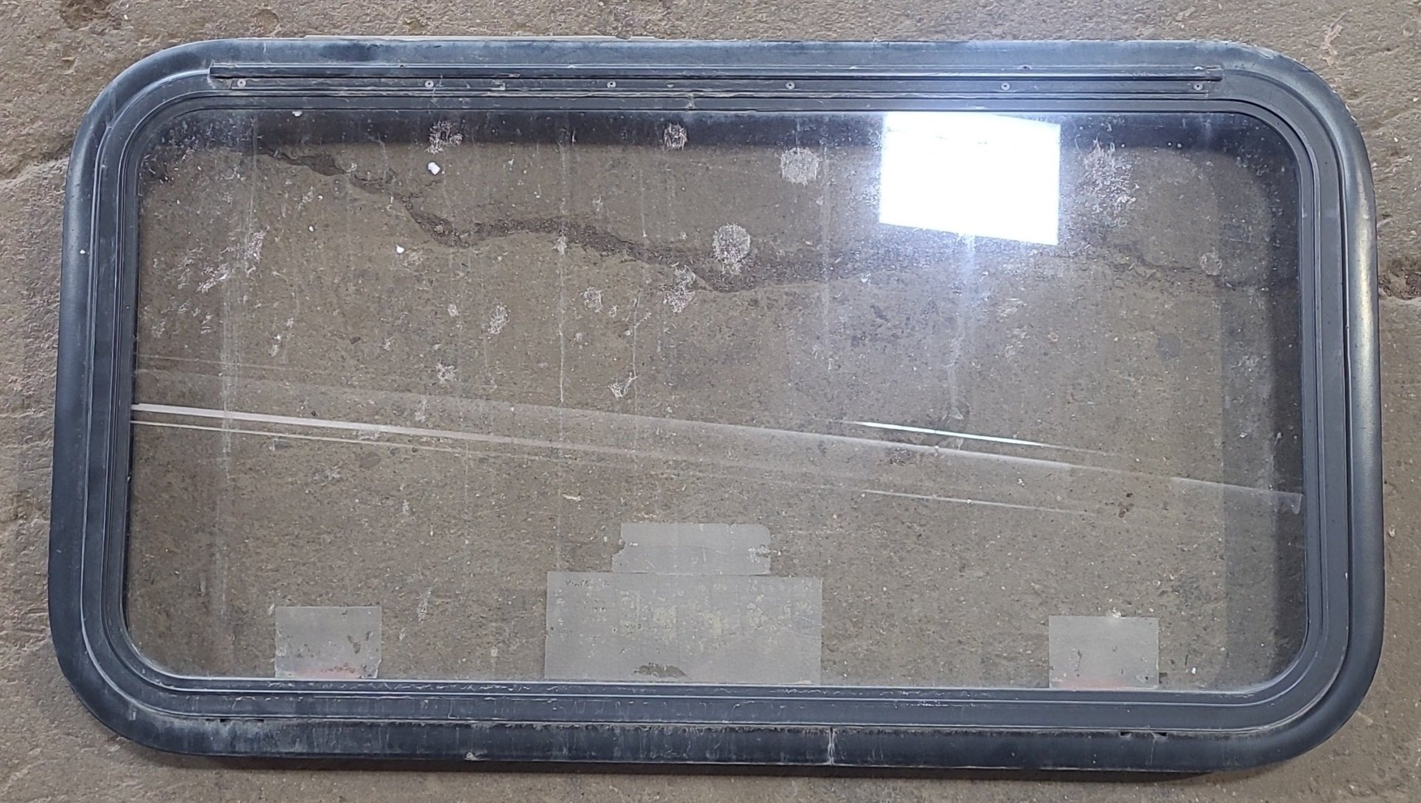 Used Black Radius Emergency Opening Window : 35 1/2" W x 18 1/2" H x 1 7/8" D - Young Farts RV Parts