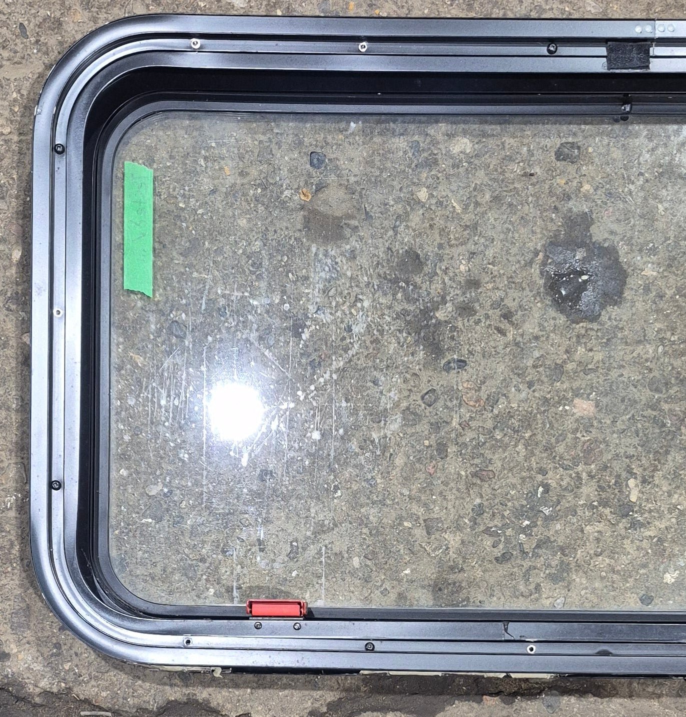 Used Black Radius Emergency Opening Window : 35 1/2" W x 18 3/4" H x 1 7/8" - Young Farts RV Parts