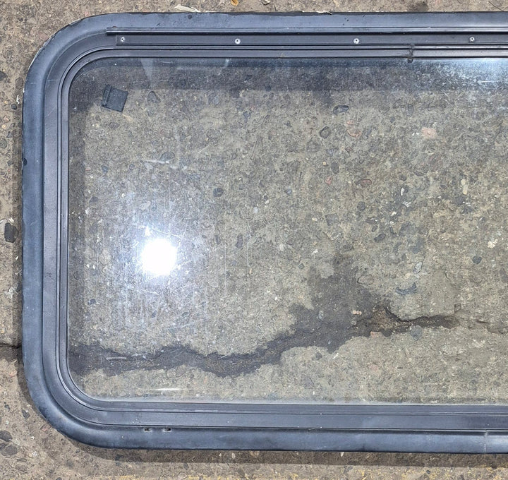 Used Black Radius Emergency Opening Window : 35 1/2" W x 18 3/4" H x 1 7/8" - Young Farts RV Parts