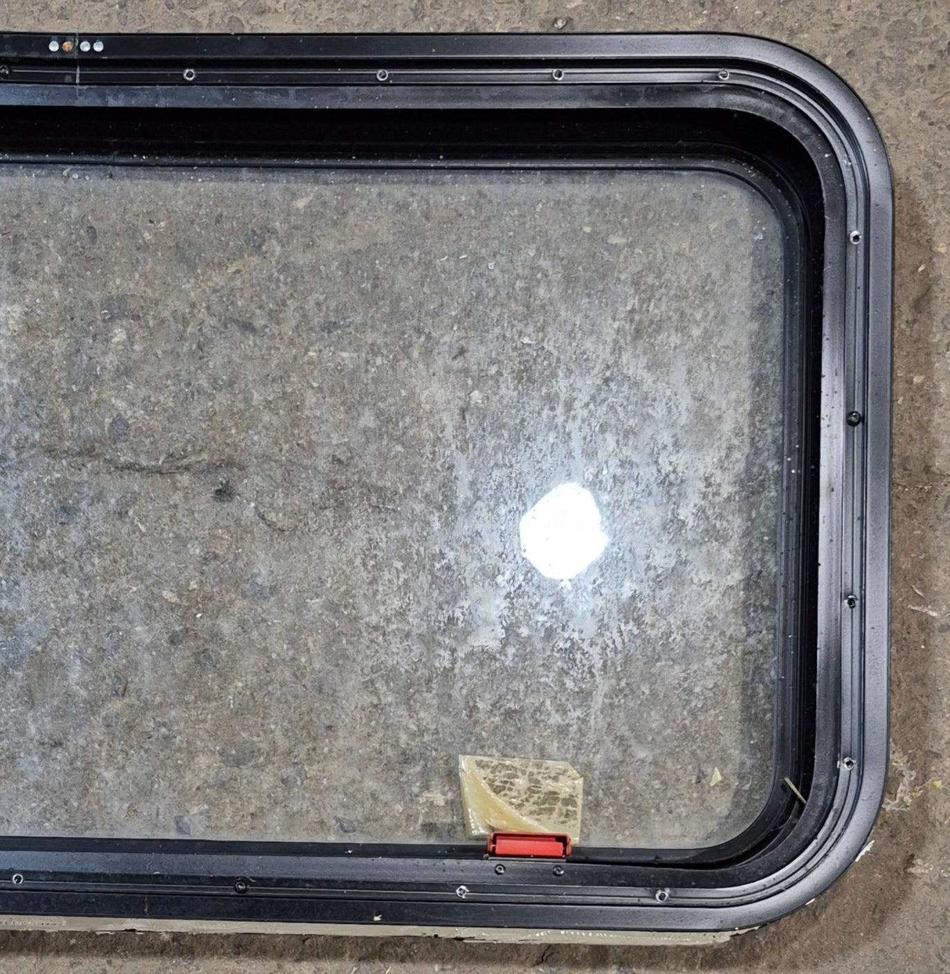 Used Black Radius Emergency Opening Window : 35 1/4" W x 18 1/2" H x 1 7/8" - Young Farts RV Parts