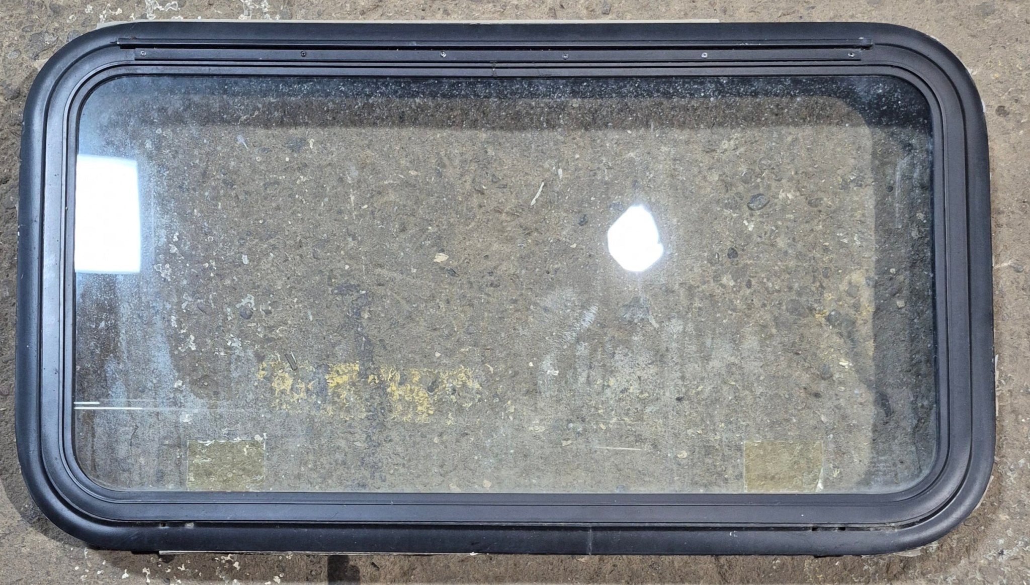 Used Black Radius Emergency Opening Window : 35 1/4" W x 18 1/2" H x 1 7/8" - Young Farts RV Parts