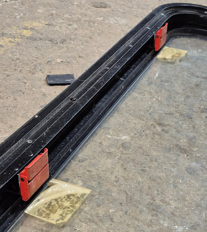 Used Black Radius Emergency Opening Window : 35 1/4" W x 18 1/2" H x 1 7/8" - Young Farts RV Parts