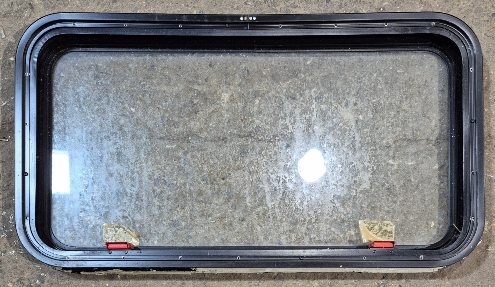 Used Black Radius Emergency Opening Window : 35 1/4" W x 18 1/2" H x 1 7/8" - Young Farts RV Parts