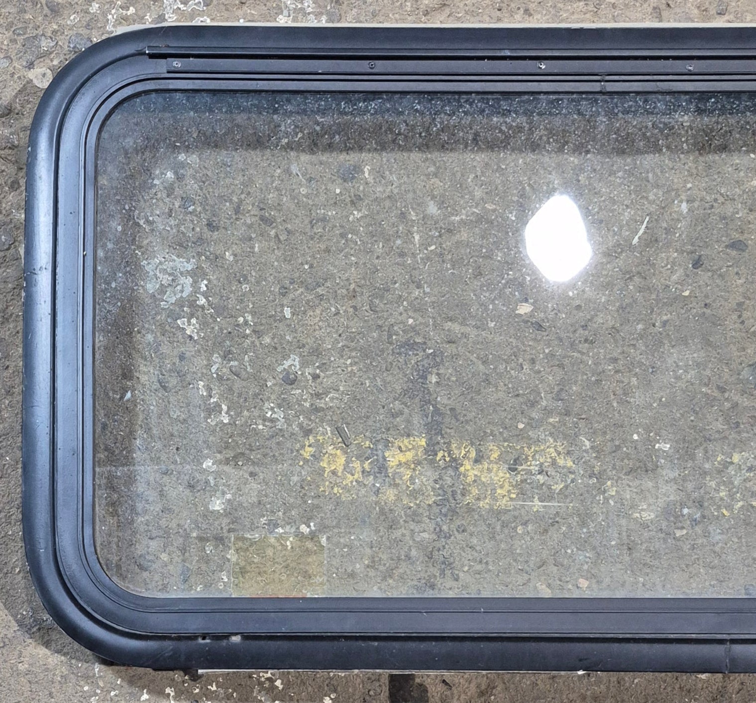Used Black Radius Emergency Opening Window : 35 1/4" W x 18 1/2" H x 1 7/8" - Young Farts RV Parts