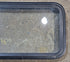 Used Black Radius Emergency Opening Window : 35 1/4" W x 18 1/2" H x 1 7/8" - Young Farts RV Parts