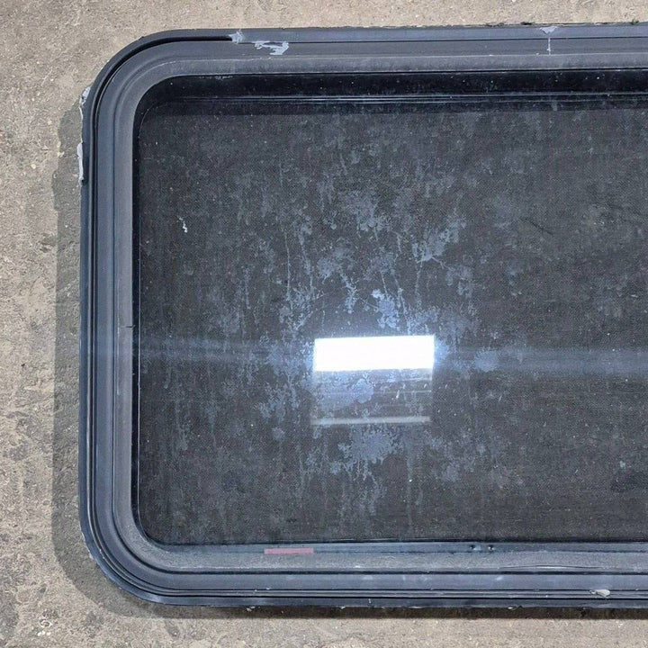 Used Black Radius Emergency Opening Window - 35 1/8" X 21 1/4" X 1 7/8" - Young Farts RV Parts