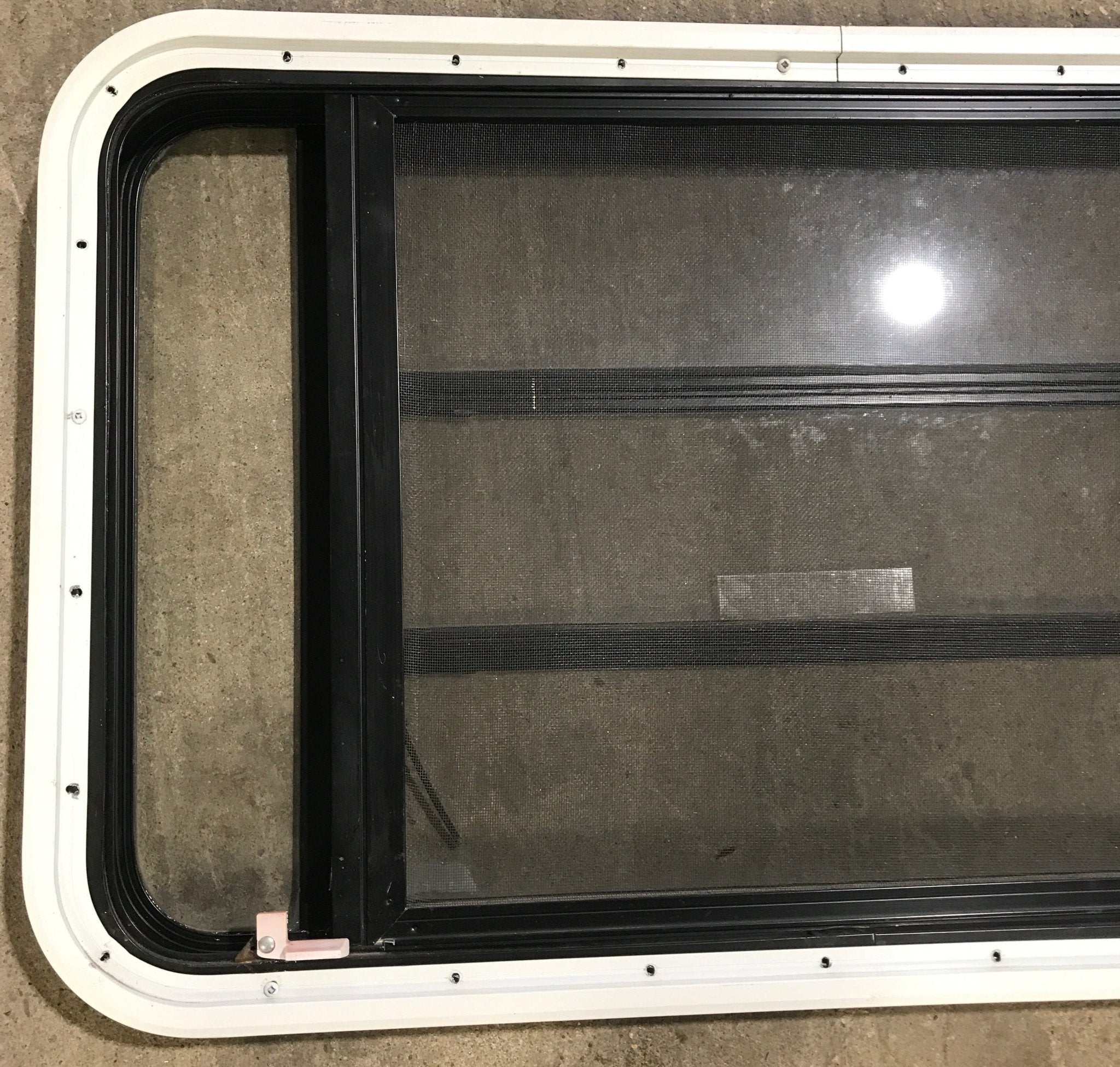 Used Black Radius Emergency Opening Window : 35" W x 21 1/4" H x 1 7/8" D - Young Farts RV Parts