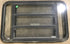 Used Black Radius Emergency Opening Window : 35" W x 21 1/4" H x 1 7/8" D - Young Farts RV Parts