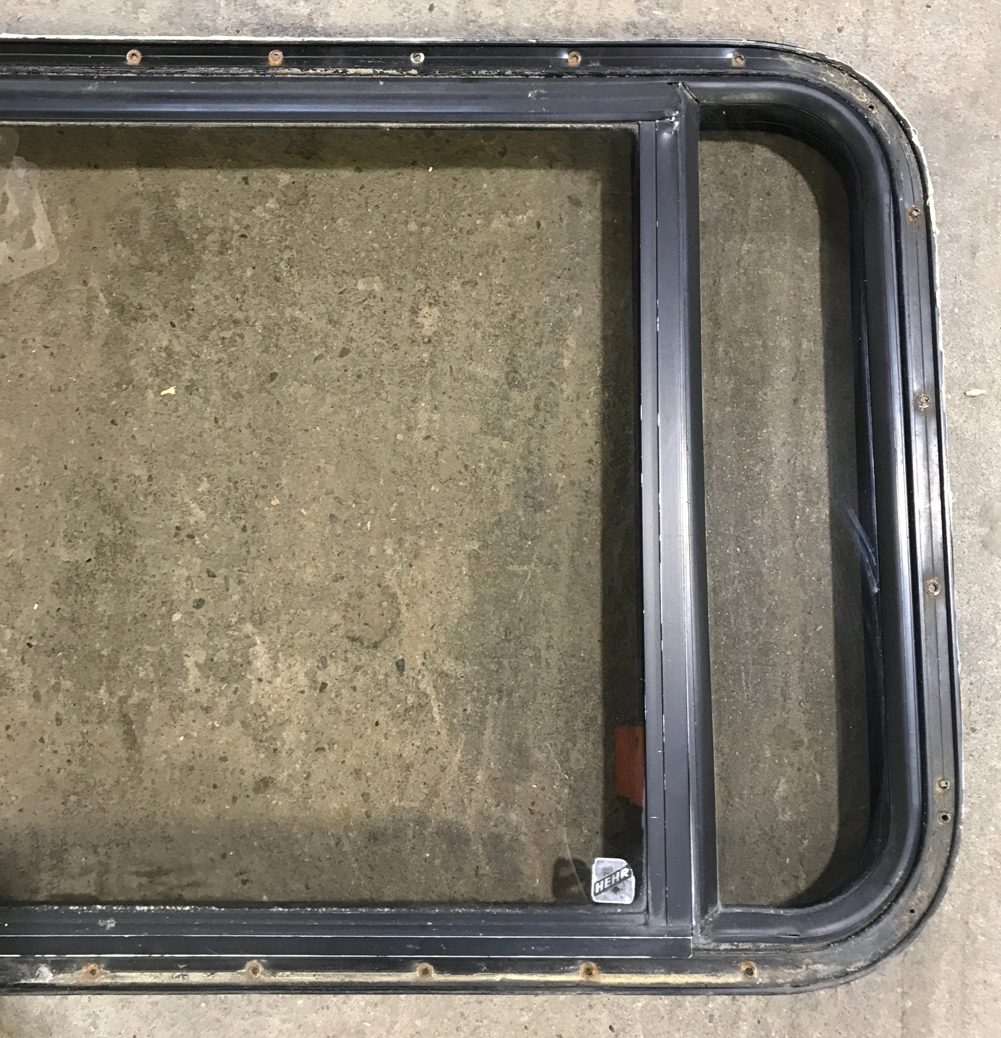 Used Black Radius Emergency Opening Window : 36 1/2" W x 23 1/2" H x 1 1/2" - Young Farts RV Parts