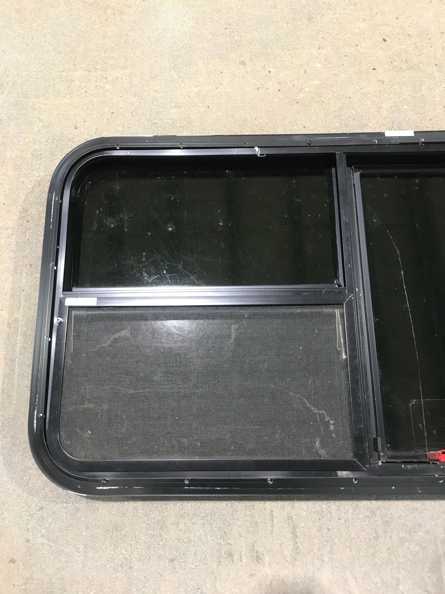 Used Black Radius Emergency Opening Window : 41 1/2" W x 21 1/2" H x 1 7/8" - Young Farts RV Parts