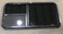 Used Black Radius Emergency Opening Window : 41 1/2" W x 21 1/2" H x 1 7/8" - Young Farts RV Parts