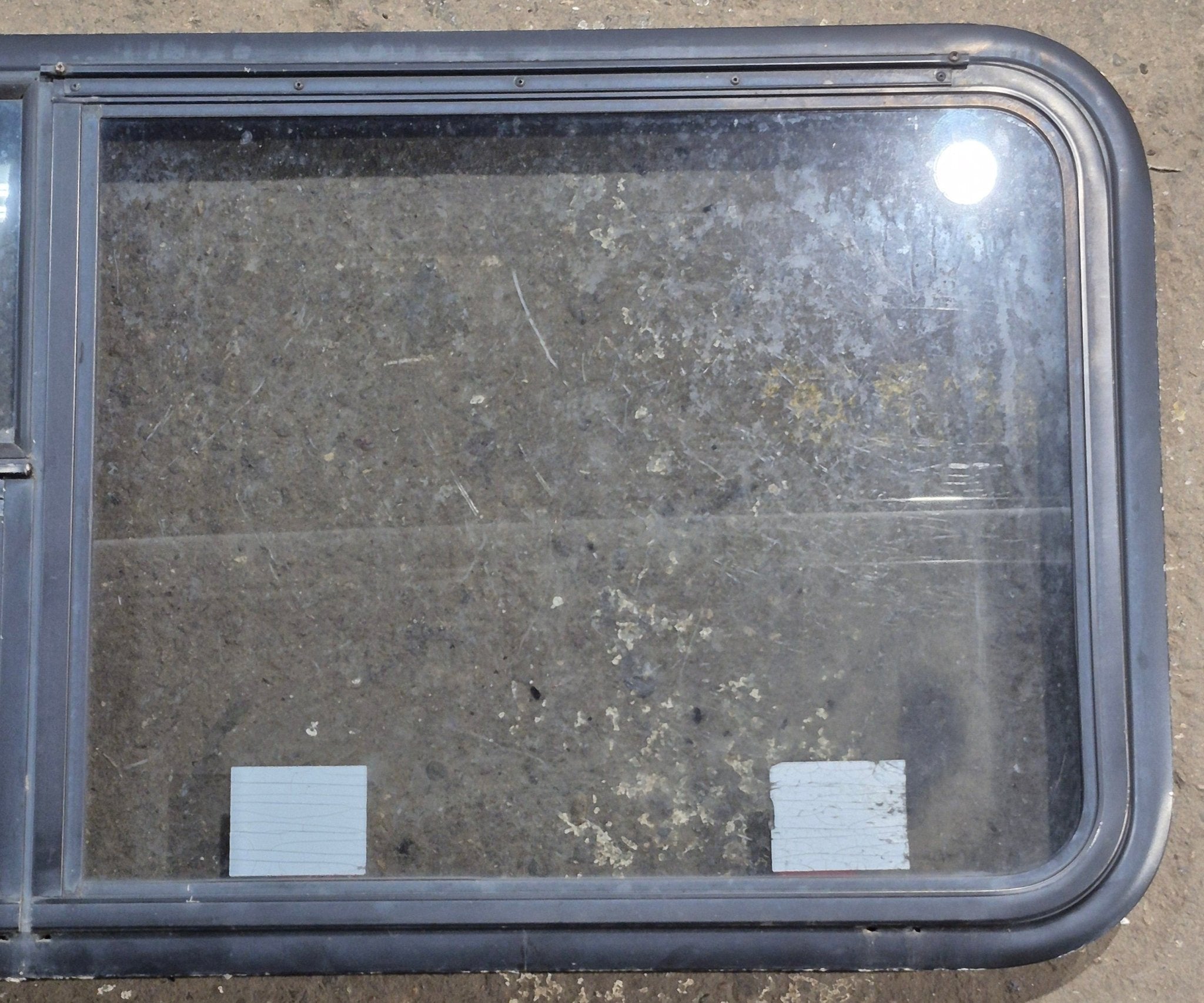 Used Black Radius Emergency Opening Window : 47 1/4" W x 21 1/4" H x 1 3/4" D - Young Farts RV Parts
