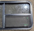 Used Black Radius Emergency Opening Window : 47 1/4" W x 21 1/4" H x 1 3/4" D - Young Farts RV Parts
