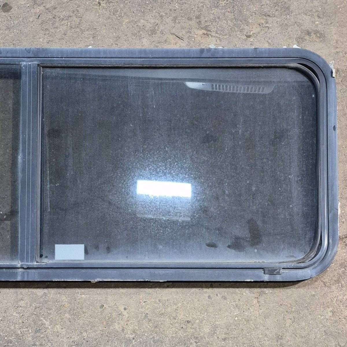 Used Black Radius Emergency Opening Window - 60 X 21.75 X 1.875 - Young Farts RV Parts