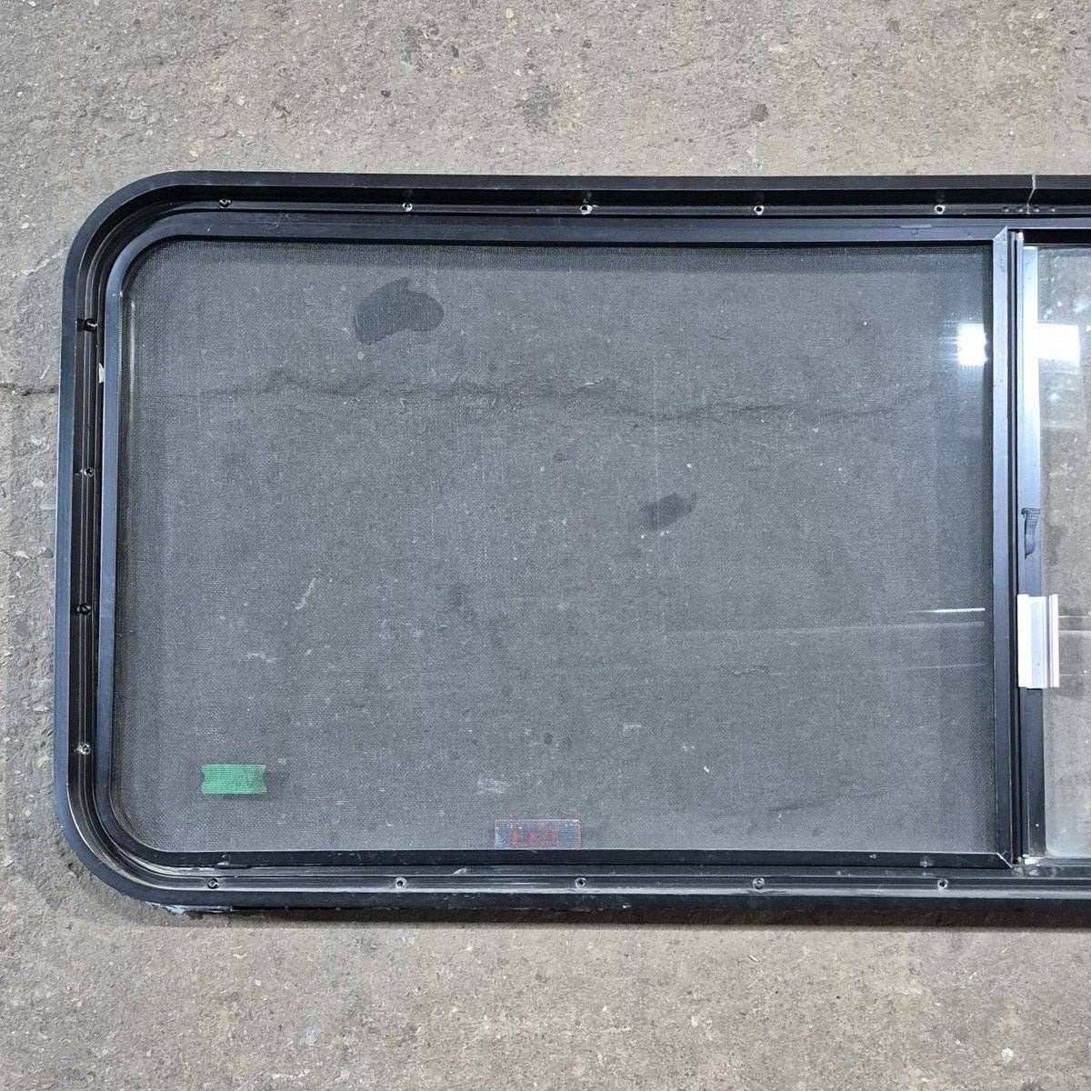 Used Black Radius Emergency Opening Window - 60.25 X 21.75 X 1.75 - Young Farts RV Parts