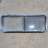 Used Black Radius Emergency Opening Window - 60.25 X 21.75 X 1.75 - Young Farts RV Parts