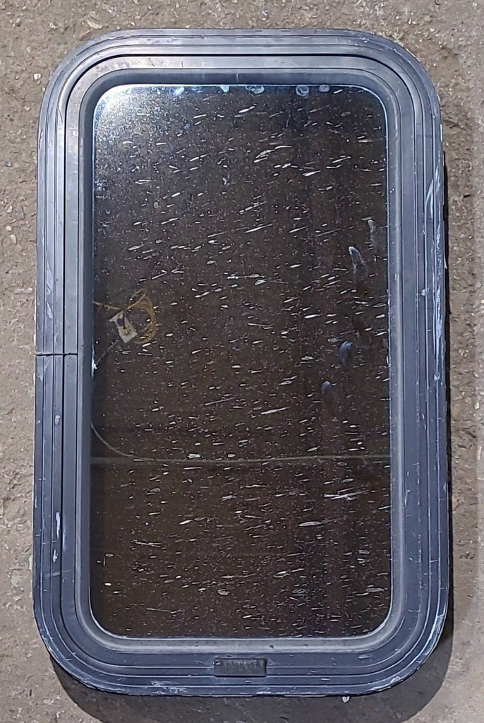 Used Black Radius Non Opening Window : 13 1/2" W x 23 1/2" H x 1 3/4" D - Young Farts RV Parts