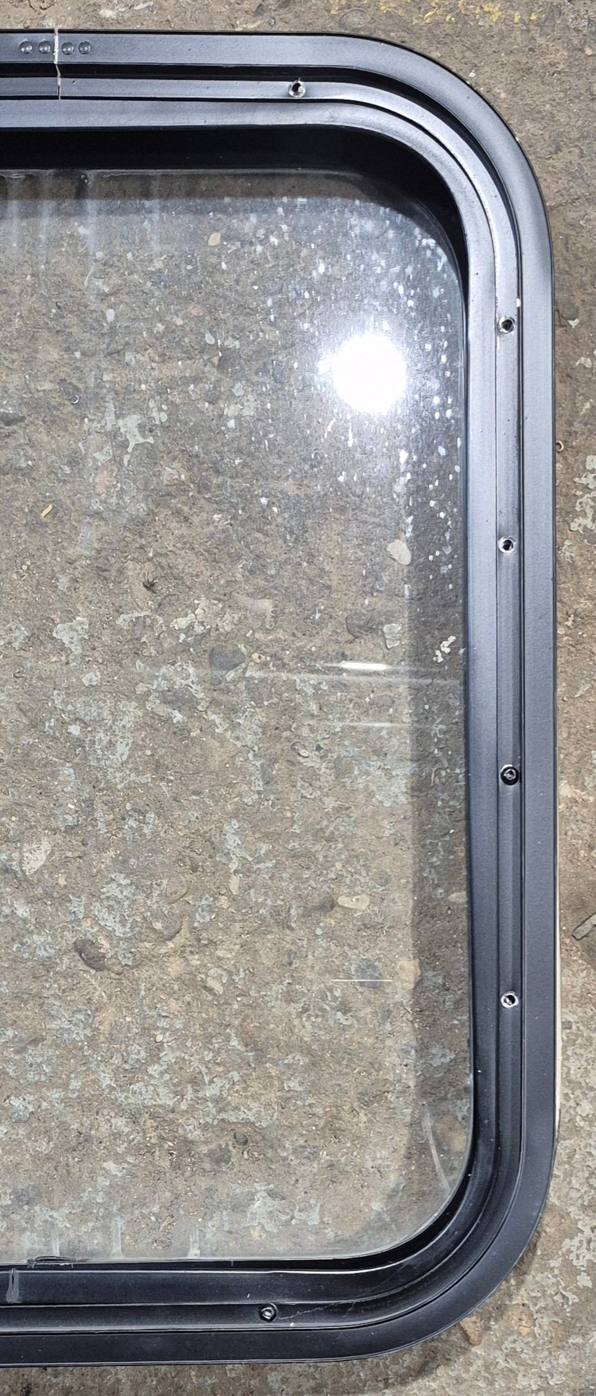 Used Black Radius Non Opening Window : 17 1/2" W x 21 1/4" H x 1 7/8" - Young Farts RV Parts