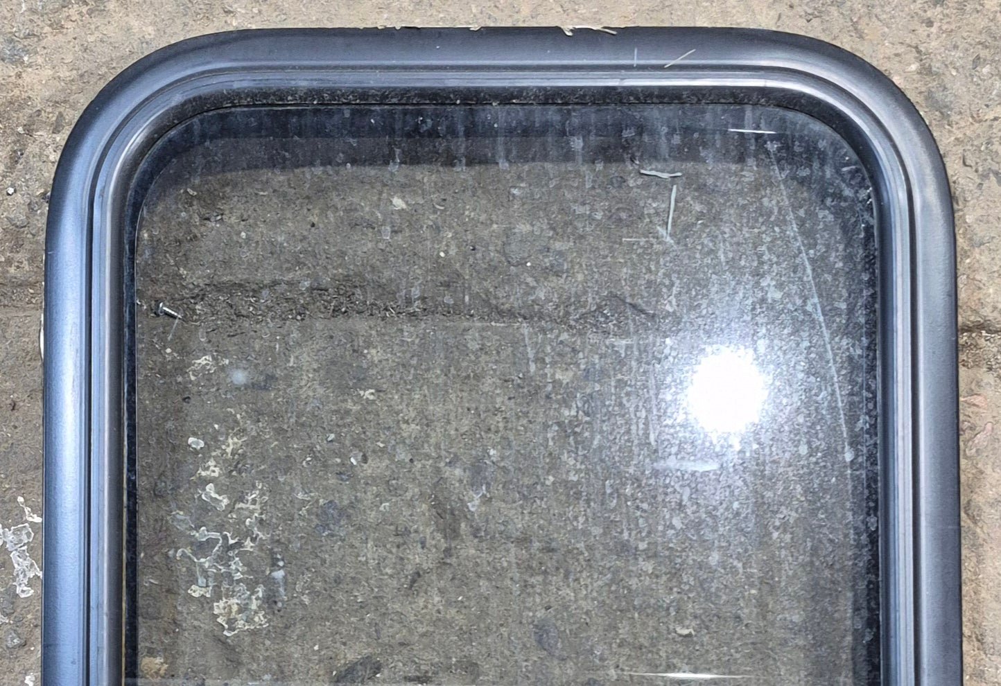 Used Black Radius Non Opening Window : 17 1/4" W x 21 1/2" H x 1 3/4" - Young Farts RV Parts