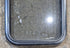 Used Black Radius Non Opening Window : 17 1/4" W x 21 1/2" H x 1 3/4" - Young Farts RV Parts
