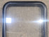 Used Black Radius Non Opening Window : 18 1/4" W x 25 3/4" H x 1 3/4" - Young Farts RV Parts