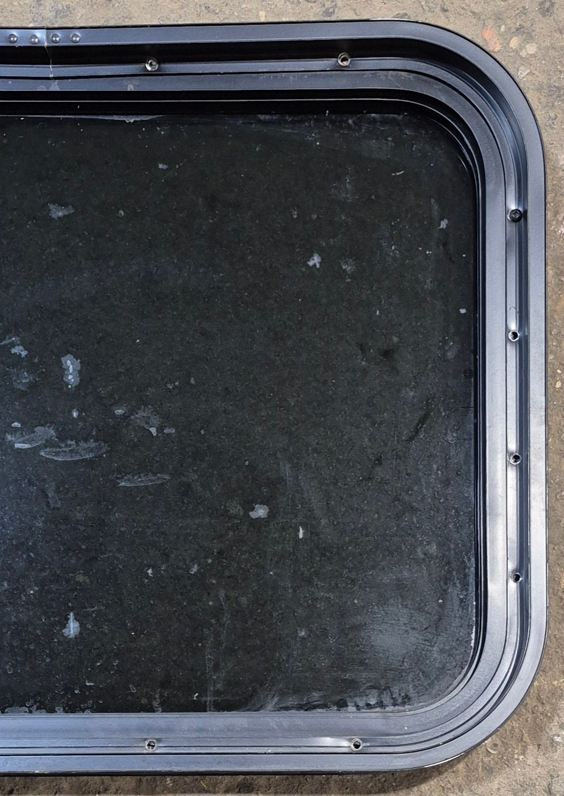 Used Black Radius Non Opening Window : 23 1/2" W x 17 1/4" H x 1 3/4" - Young Farts RV Parts