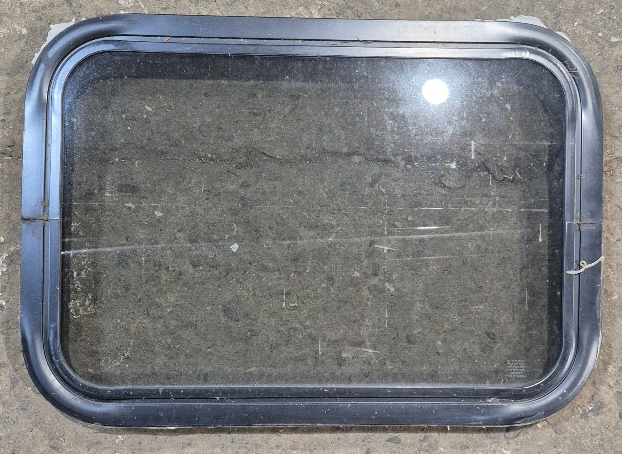 Used Black Radius Non Opening Window : 24 1/4" W x 16 3/4" H x 1 7/8" - Young Farts RV Parts
