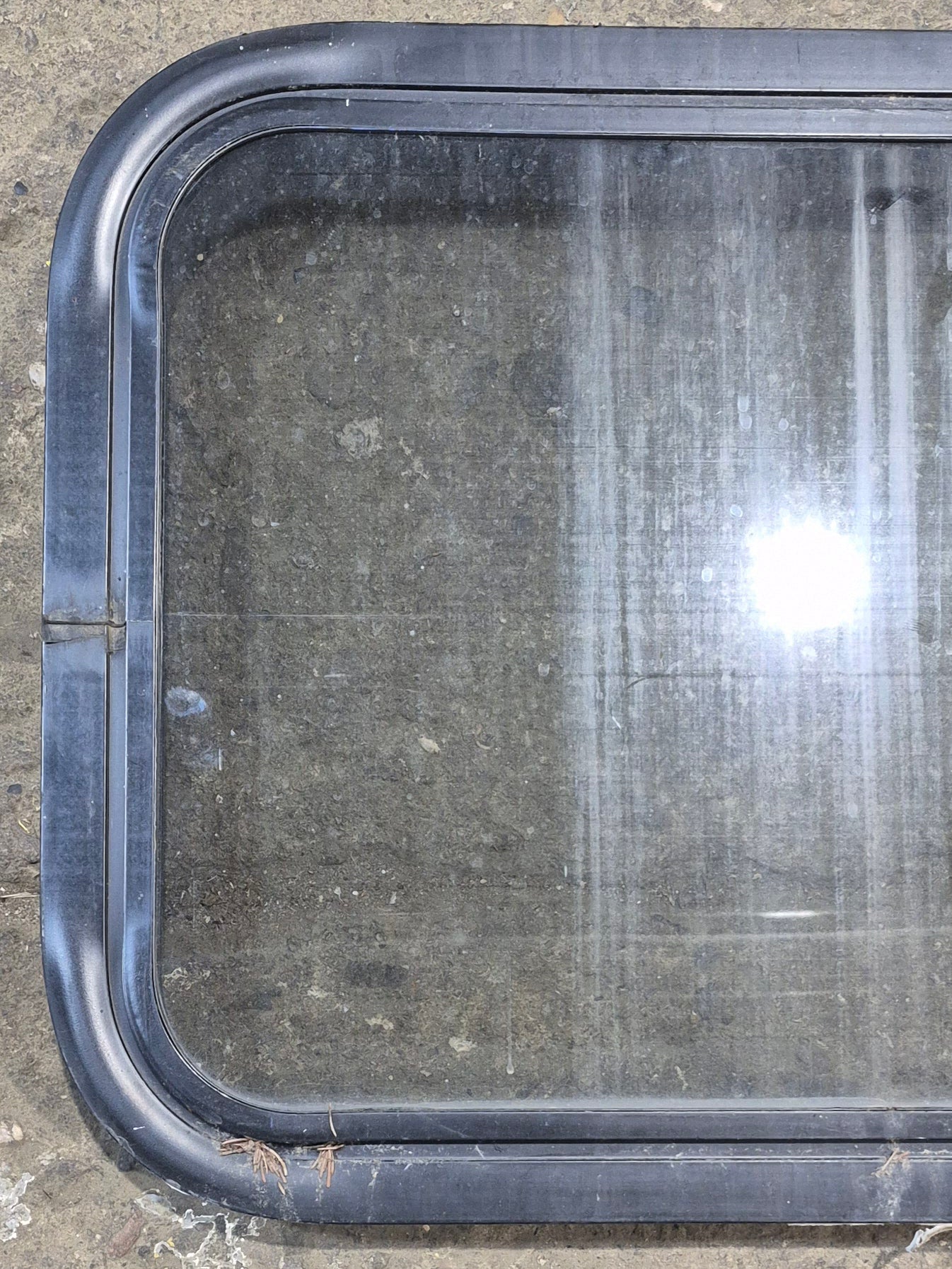 Used Black Radius Non Opening Window : 24 1/4" W x 16 3/4" H x 1 7/8" - Young Farts RV Parts