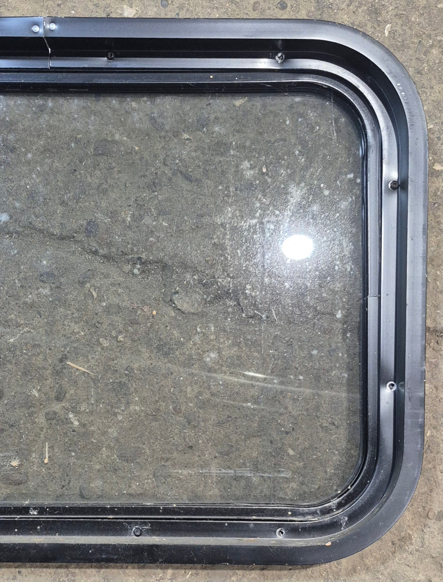 Used Black Radius Non Opening Window : 24 1/4" W x 16 3/4" H x 1 7/8" - Young Farts RV Parts