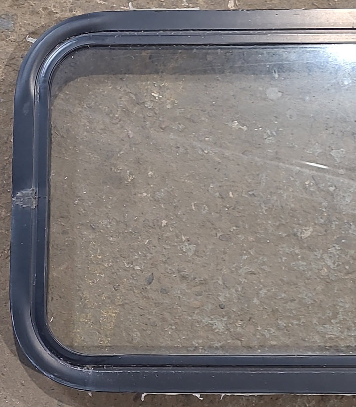 Used Black Radius Non Opening Window : 24 1/4" W x 16 3/4" H x 1 7/8" D - Young Farts RV Parts