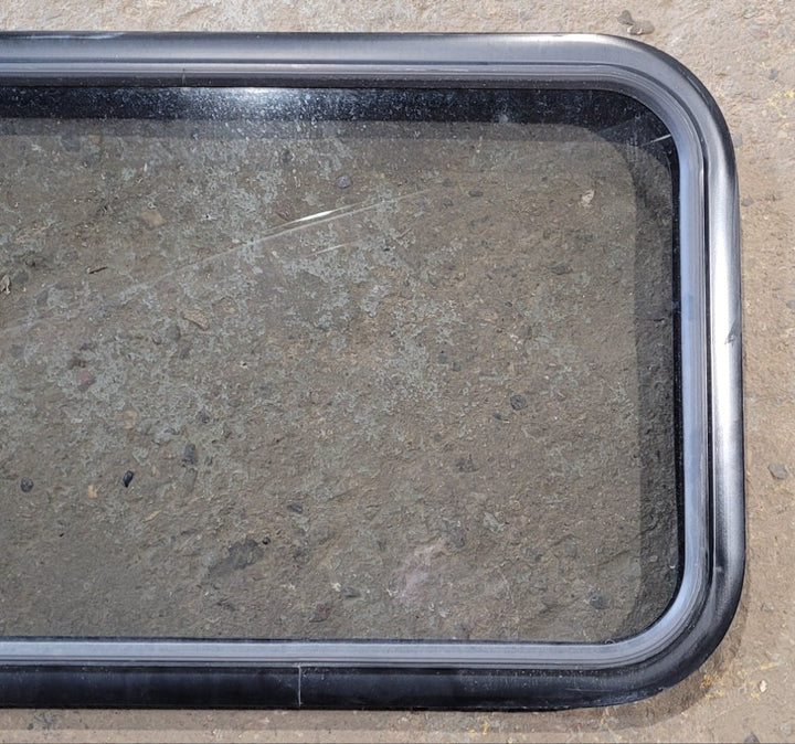 Used Black Radius Non Opening Window : 29 1/2" W x 17 1/2" H x 1 7/8" D - Young Farts RV Parts