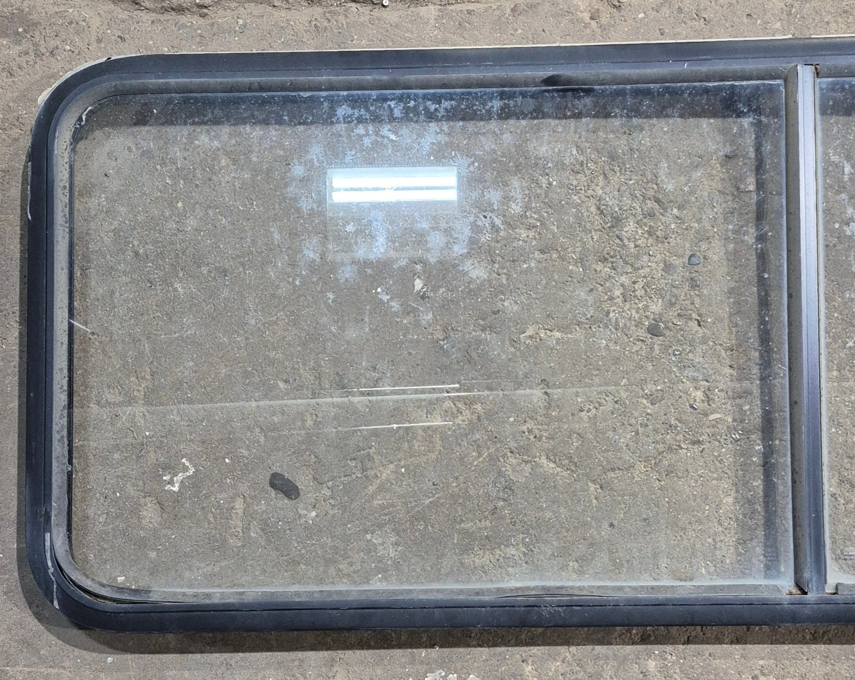 Used Black Radius Non Opening Window : 60 1/4" W x 21 3/4" H x 1 5/8" D - Young Farts RV Parts