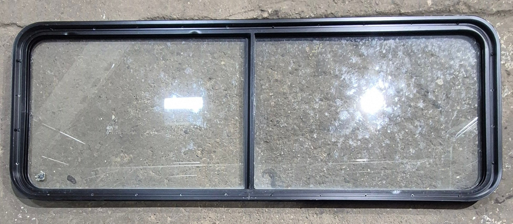 Used Black Radius Non Opening Window : 60 1/4" W x 21 3/4" H x 1 5/8" D - Young Farts RV Parts