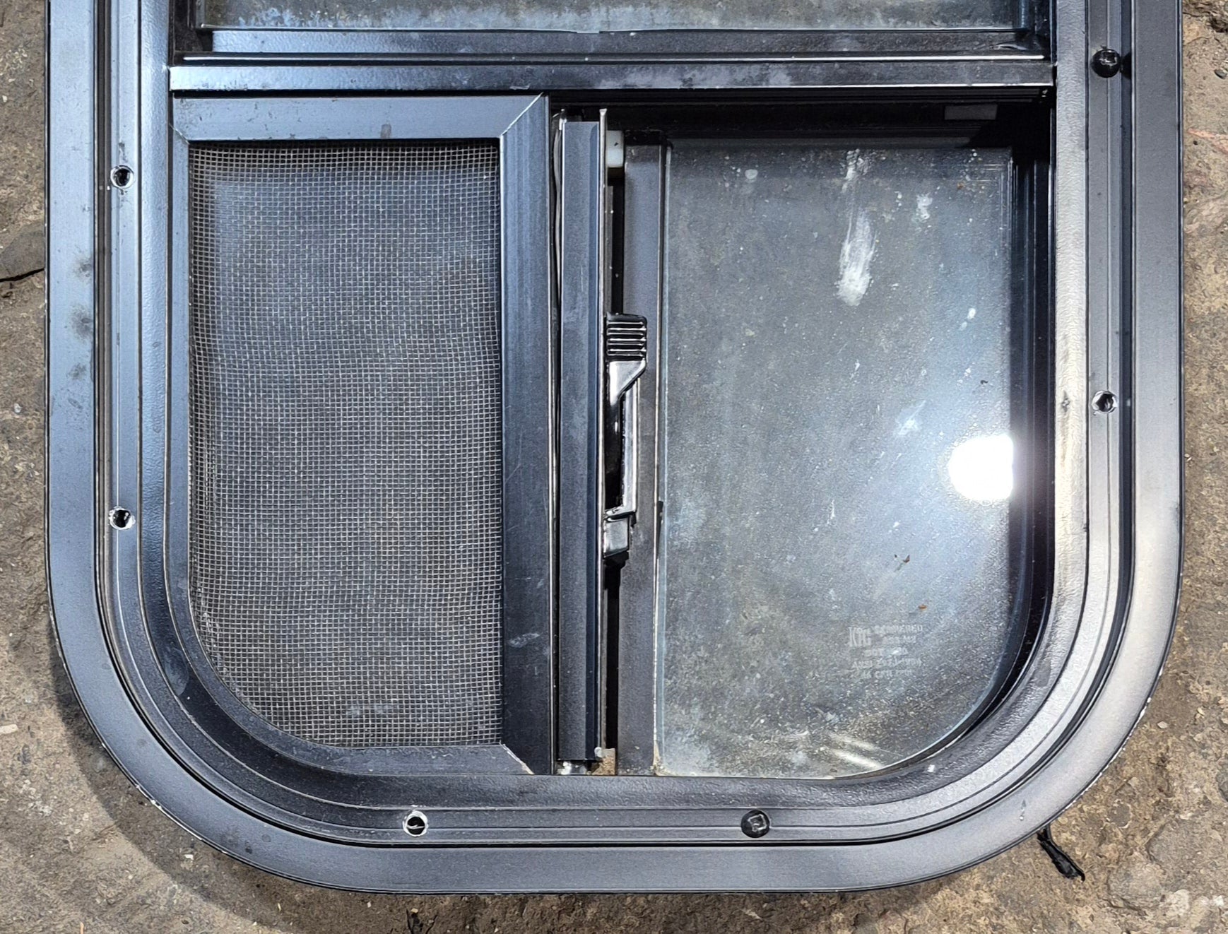 Used Black Radius Opening Window : 11 1/2" W x 21 1/4" H x 1 3/4" D - Young Farts RV Parts