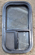 Used Black Radius Opening Window : 11 1/2" W x 21 1/4" H x 1 3/4" D - Young Farts RV Parts