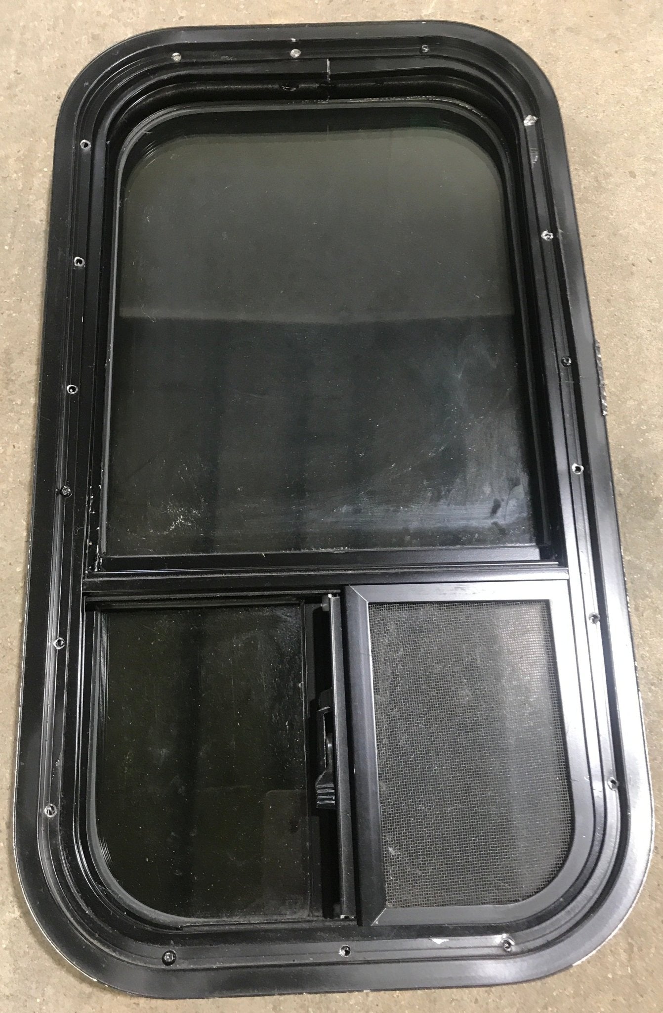 Used Black Radius Opening Window : 13 1/2" W x 25 1/2" H x 1 7/8" D - Young Farts RV Parts