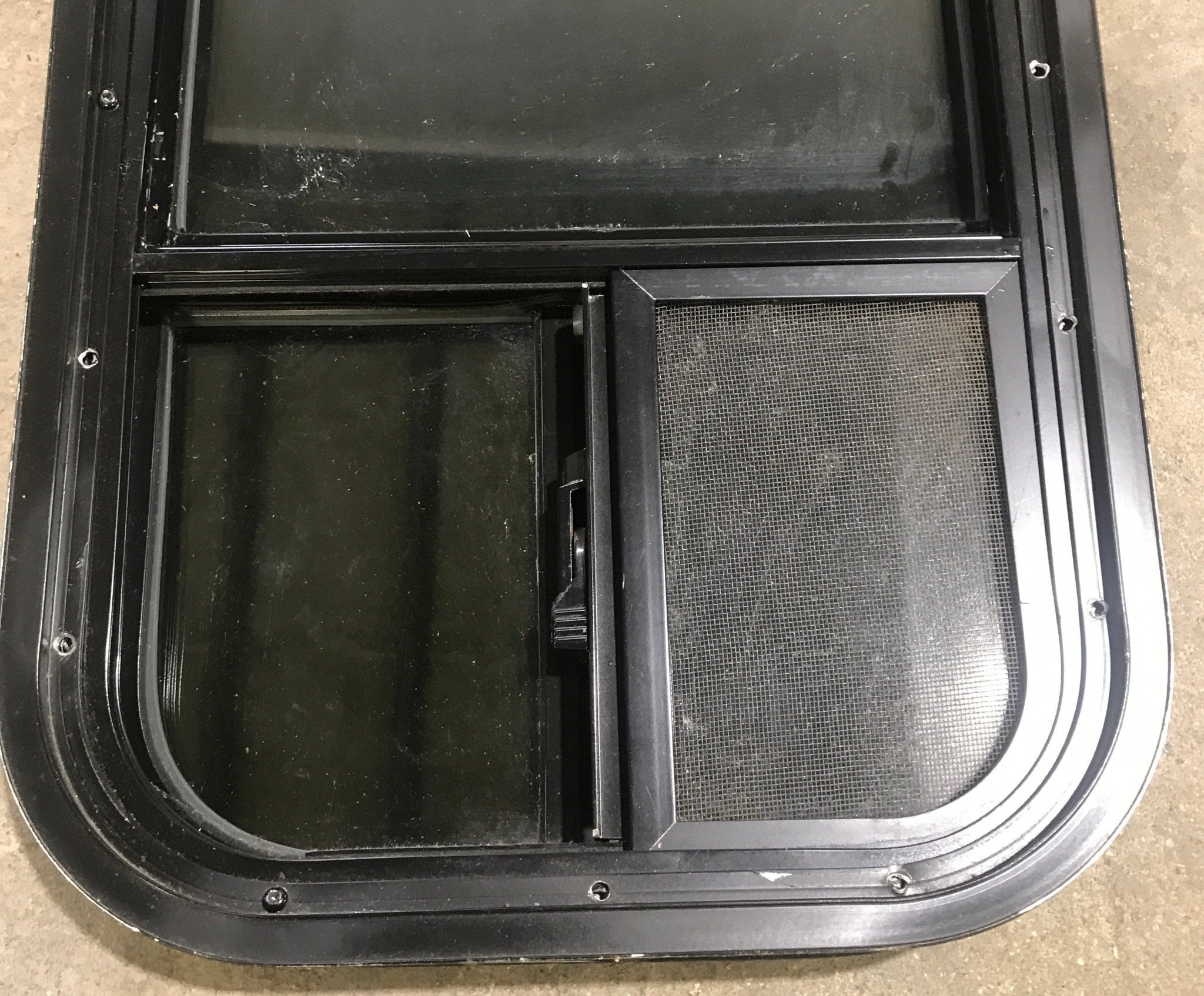 Used Black Radius Opening Window : 13 1/2" W x 25 1/2" H x 1 7/8" D - Young Farts RV Parts