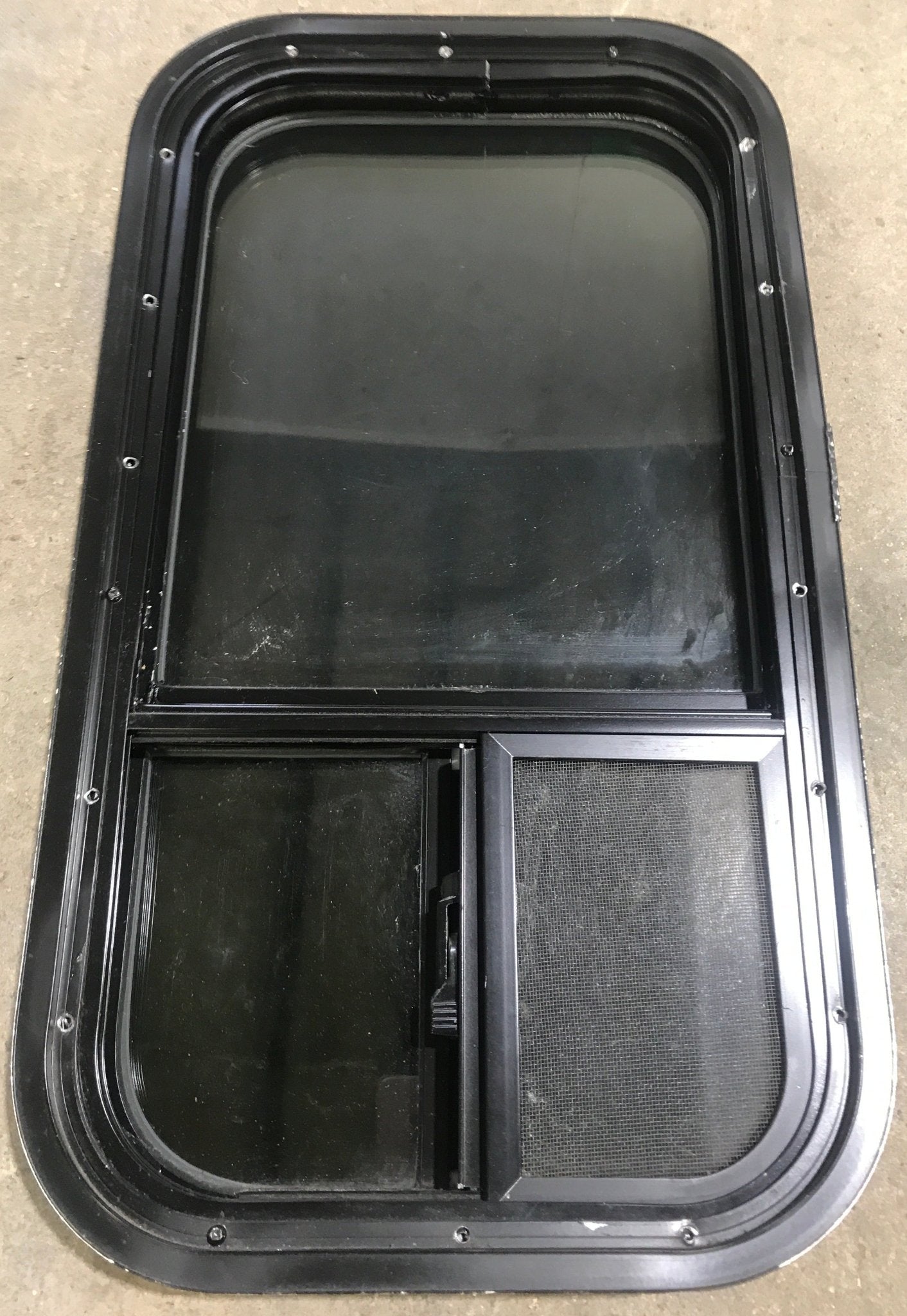 Used Black Radius Opening Window : 13 1/2" W x 25 1/2" H x 1 7/8" D - Young Farts RV Parts
