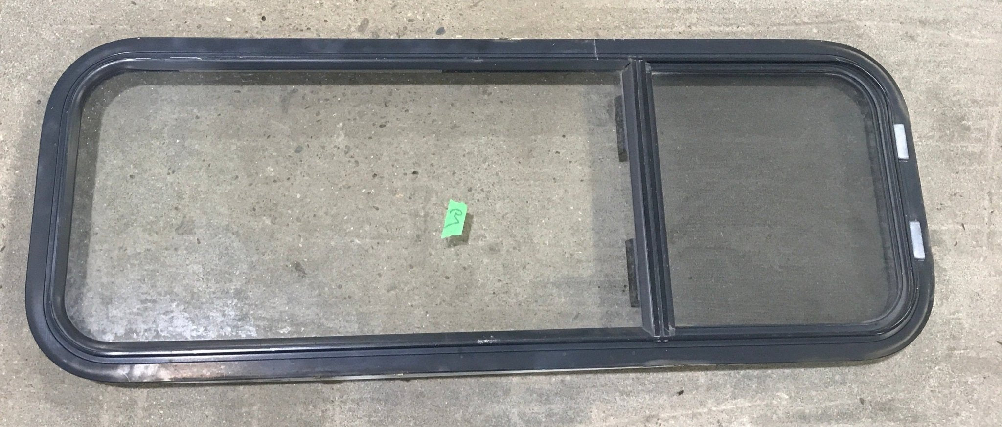 Used Black Radius Opening Window : 15 1/2" W x 41 1/2" H x 2" D - Young Farts RV Parts
