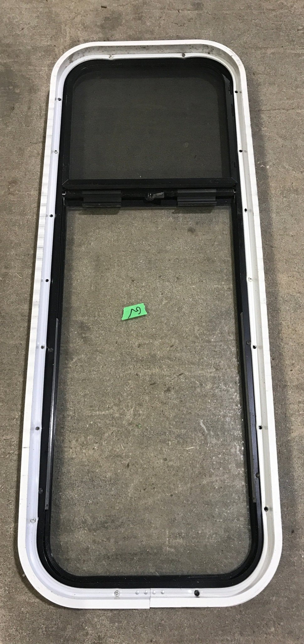 Used Black Radius Opening Window : 15 1/2" W x 41 1/2" H x 2" D - Young Farts RV Parts
