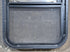 Used Black Radius Opening Window : 17 1/2" W x 25 1/4" H x 1 7/8" D - Young Farts RV Parts